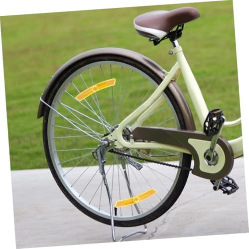 Yellow plastic bicycle spoke reflectors — photo 4